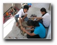 Sis Grisha, Seema and Poorani enjoying doing seva - Click to enlarge